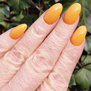 Among The Marigolds CND yellow orange nails