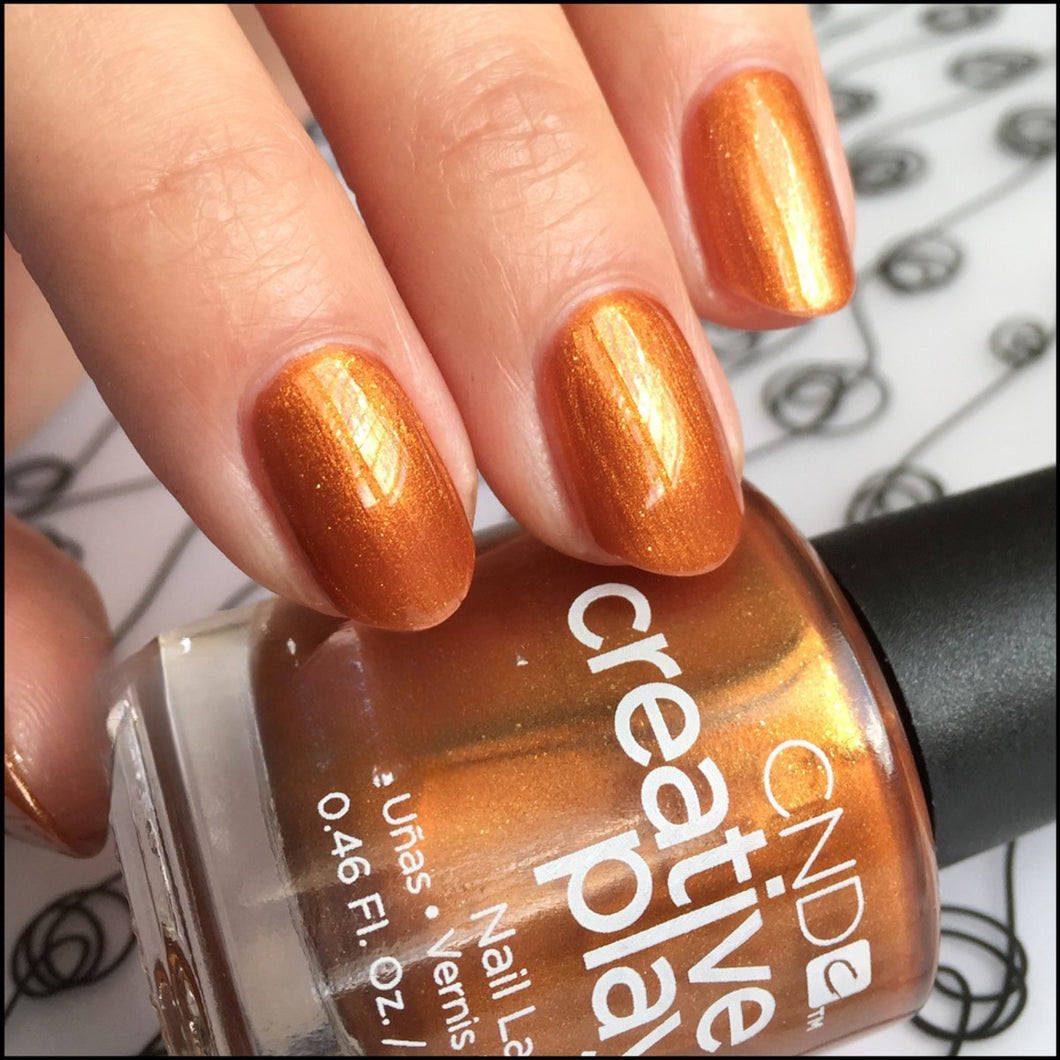 Lost in Spice - gold pearl nail polish CND