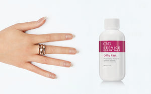 A hand with healthy long nails and a bottle of CND Offly Fast Moisturising Nail Polish Remover