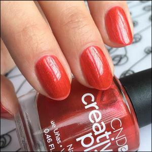 Persimmon-ality red nail polish CND