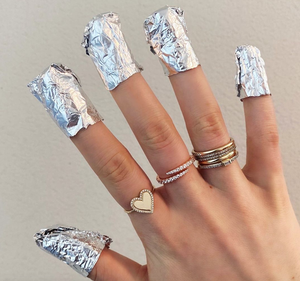 Close up of how to wrap fingernails when removing gel polish at home