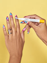 Load image into Gallery viewer, Solar Oil Pen being used over nail polish
