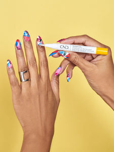 Solar Oil Pen being used over nail polish