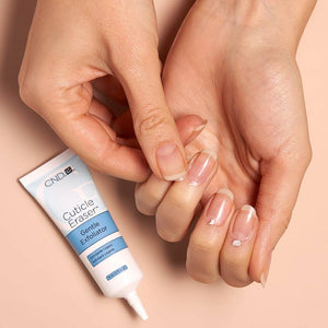 Applying CND Cuticle Eraser cream to each fingernail